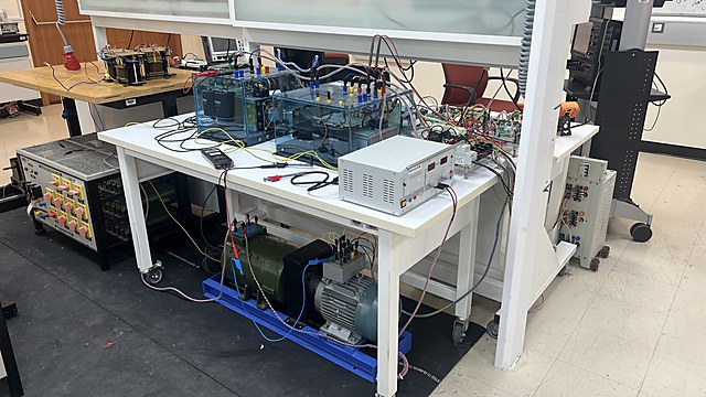 Experimental five-phase induction-machine drive platform used for controller development and validation.